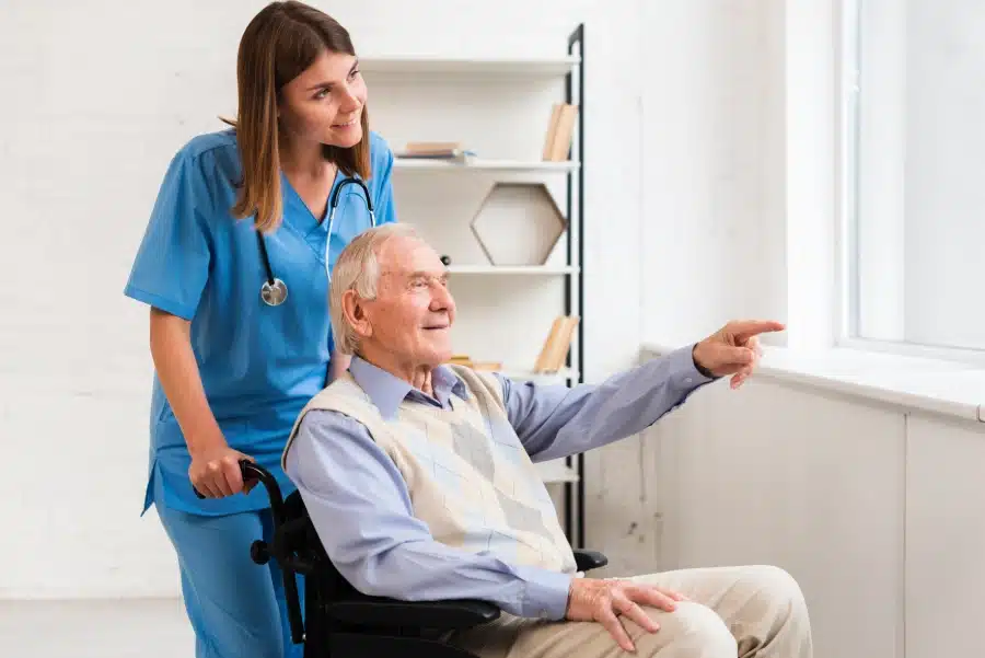 old man pointing window while talking nurse